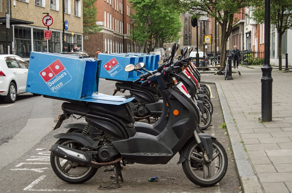 Three brokers slice into Domino's and ask whether the dip is worth buying 