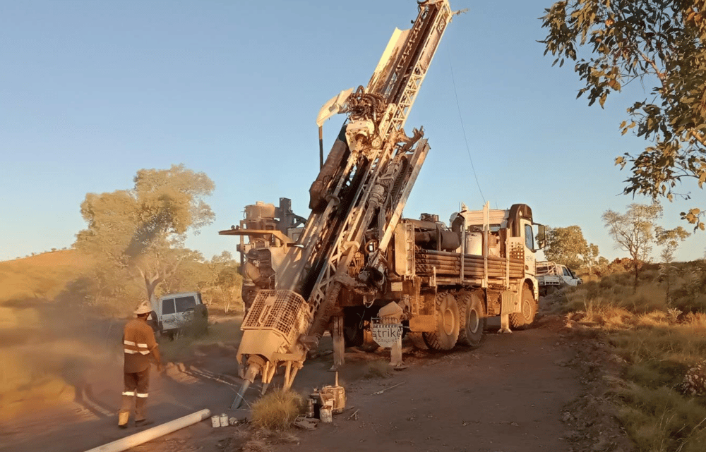 A Strike Drilling-owned RC rig perforating the first drillhole sunk onsite the Horry copper-gold project 